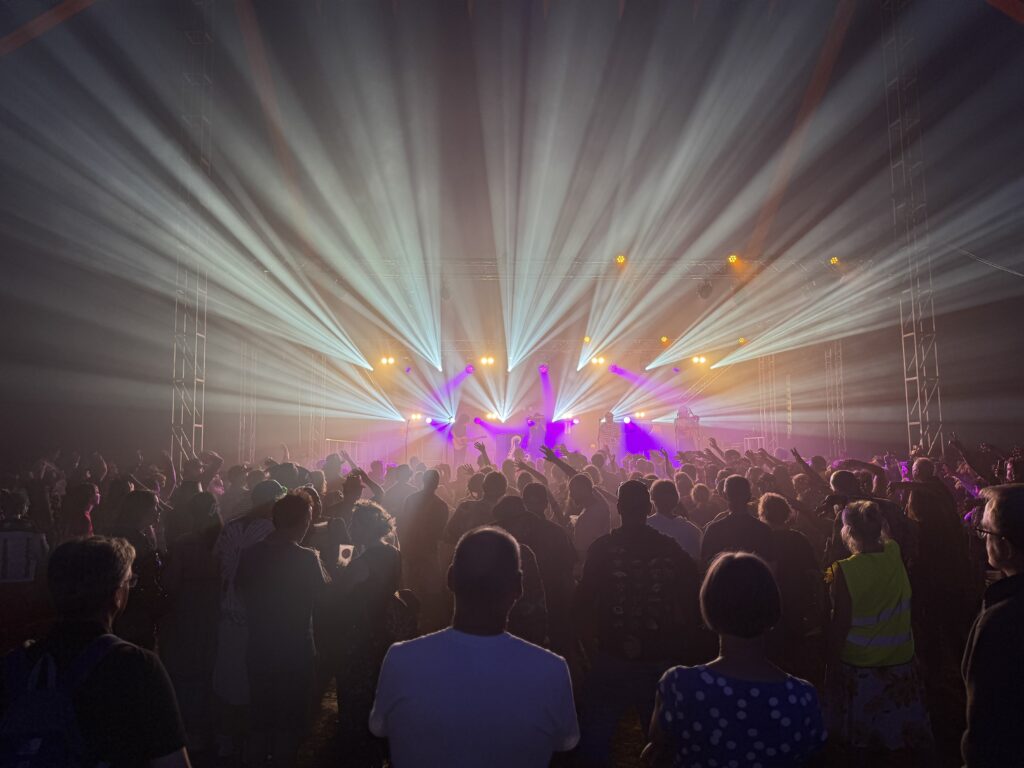 Professional stage lighting with atmospheric moving light effects for a live event